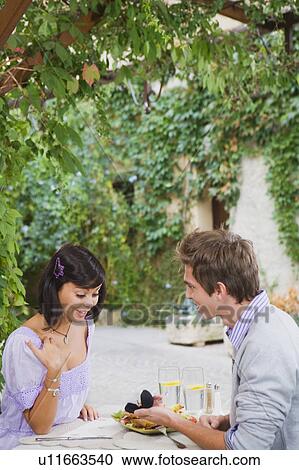 Stock Image - Man proposing to woman.. Fotosearch