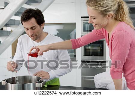 Portrait of a couple cooking. View Large Photo Image Picture - Portrait of a couple cooking.. Fotosearch