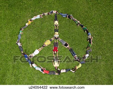 Group lying on grass in a peace sign formation View Large Photo Image Stock Image - Group lying on grass in a peace sign formation. Fotosearch