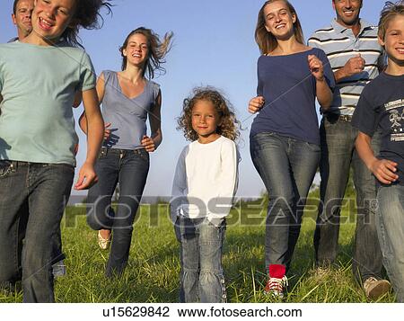 Group of people and children running. View Large Photo Image Stock Image - Group of people and children running.. Fotosearch