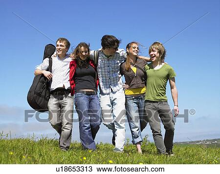 Group of young people outdoors. View Large Photo Image Stock Image - Group of young people outdoors.. Fotosearch