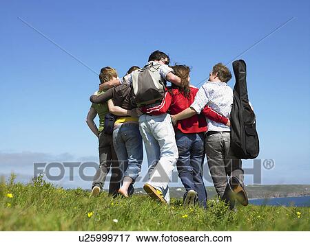 Group of young people outdoors. View Large Photo Image Stock Photo - Group of young people outdoors.. Fotosearch