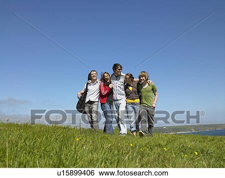Group of young people outdoors. View Large Photo Image Stock Photograph - Group of young people outdoors.. Fotosearch