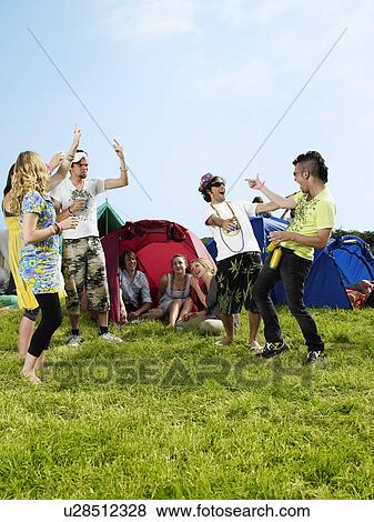 Group partying outside tents View Large Photo Image Stock Photo - Group partying outside tents. Fotosearch