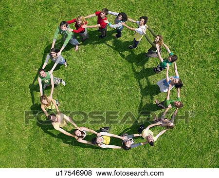 Group standing joined in a circle View Large Photo Image Stock Photo - Group standing joined in a circle. Fotosearch