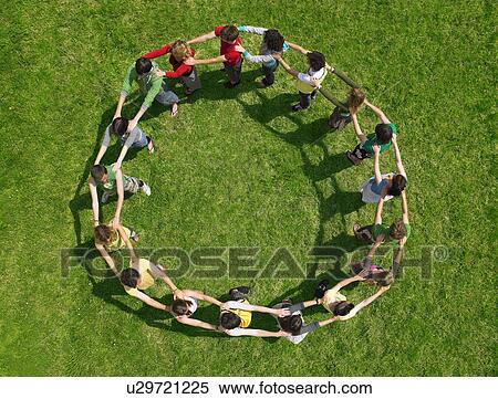 Group standing joined in a circle View Large Photo Image Stock Photography - Group standing joined in a circle. Fotosearch