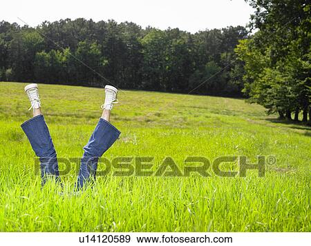 Legs of a woman pointing towards the sky. View Large Photo Image Stock Photo - Legs of a woman pointing towards the sky.. Fotosearch