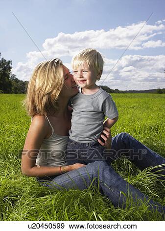 Mother and son playing in a field. View Large Photo Image Stock Photo - Mother and son playing in a field.. Fotosearch