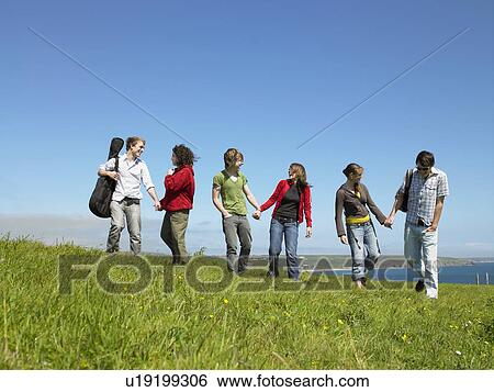 Three young couples holding hands. View Large Photo Image Stock Photograph - Three young couples holding hands.. Fotosearch