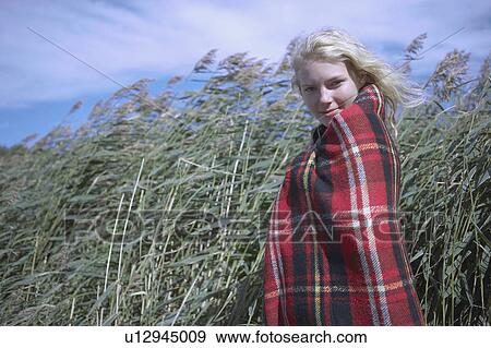 Young Woman in tartan blanket. View Large Photo Image Stock Photo - Young Woman in tartan blanket.. Fotosearch