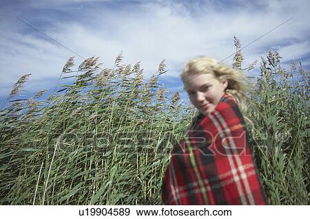 Young Woman in tartan blanket. View Large Photo Image Stock Photo - Young Woman in tartan blanket.. Fotosearch