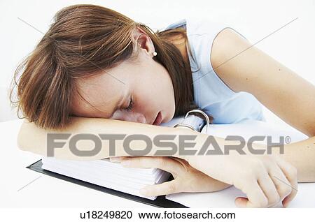 Businesswoman asleep over file View Large Photo Image Stock Image - Businesswoman asleep over file. Fotosearch