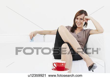 Confident woman holds credit card View Large Photo Image Stock Image - Confident woman holds credit card. Fotosearch