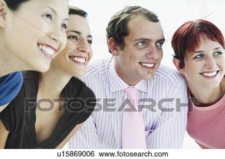 Four happy people looking off camera View Large Photo Image Stock Photograph - Four happy people looking off camera. Fotosearch