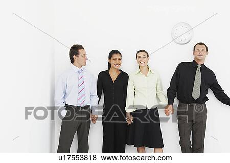 Four relaxed figures holding hands View Large Photo Image Stock Photo - Four relaxed figures holding hands. Fotosearch