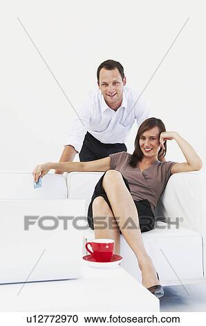 Happy, relaxed couple at home View Large Photo Image Stock Image - Happy, relaxed couple at home. Fotosearch