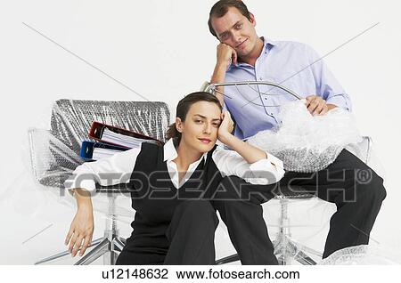 Man and woman in new office View Large Photo Image Stock Image - Man and woman in new office. Fotosearch