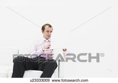 Stock Photo - Man at laptop. Fotosearch
