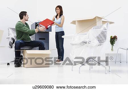 People setting up new office View Large Photo Image Stock Image - People setting up new office. Fotosearch