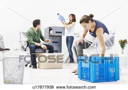 People setting up new office View Large Photo Image Stock Photo - People setting up new office. Fotosearch