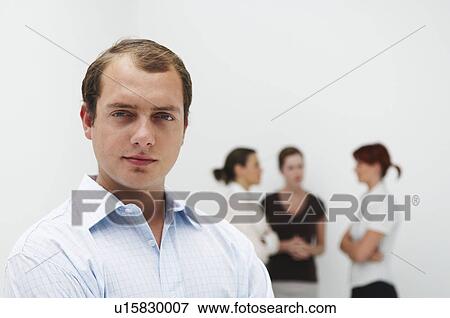 Portrait of male, figures in background View Large Photo Image Stock Photo - Portrait of male, figures in background. Fotosearch