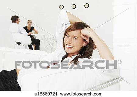 Relaxed woman smiling at camera View Large Photo Image Stock Image - Relaxed woman smiling at camera. Fotosearch