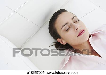 Stock Photography - Woman resting, shot from high angle. Fotosearch
