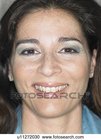 Stock Image - Close up portrait of woman smiling, Alicante, Spain,. Fotosearch