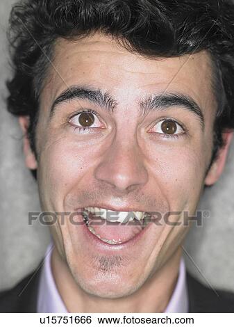 Close up portrait of young man smiling broadly, Alicante, Spain, View Large Photo Image Stock Photograph - Close up portrait of young man smiling broadly, Alicante, Spain,. Fotosearch