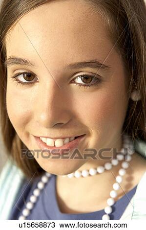 Girl (12-14) smiling, portrait, close-up View Large Photo Image Stock Image - Girl (12-14) smiling, portrait, close-up. Fotosearch