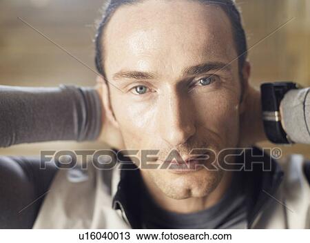 Mature man with hands behind head, close-up, portrait View Large Photo Image Stock Image - Mature man with hands behind head, close-up, portrait. Fotosearch