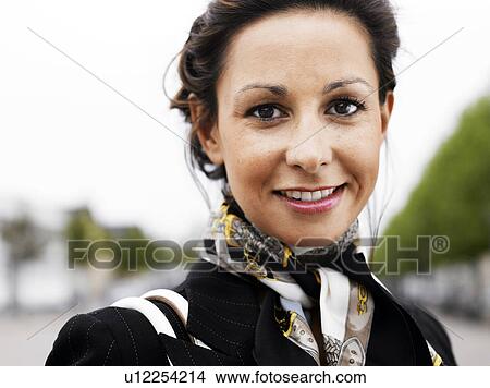 Woman standing outdoors View Large Photo Image Picture - Woman standing outdoors . Fotosearch