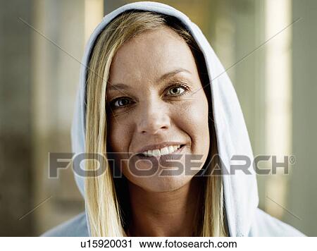 Woman wearing hooded top, smiling, portrait, close-up View Large Photo Image Stock Image - Woman wearing hooded top, smiling, portrait, close-up. Fotosearch