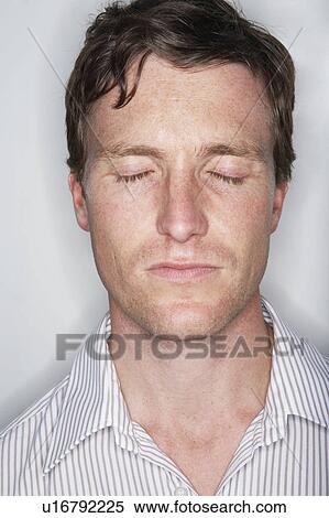 Young man with his eyes closed. View Large Photo Image Stock Photography - Young man with his eyes closed.. Fotosearch
