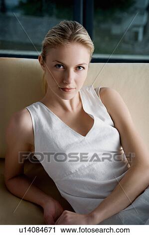 Woman on a sofa. View Large Photo Image Stock Image - Woman on a sofa.. Fotosearch