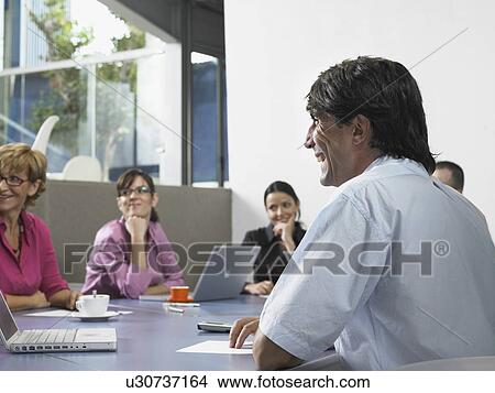 Picture - Businesspeople in a meeting. Fotosearch