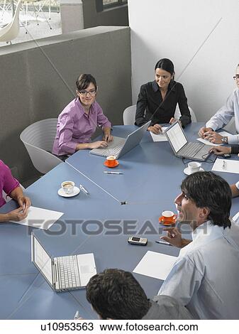 Stock Image - Businesspeople in a meeting. Fotosearch