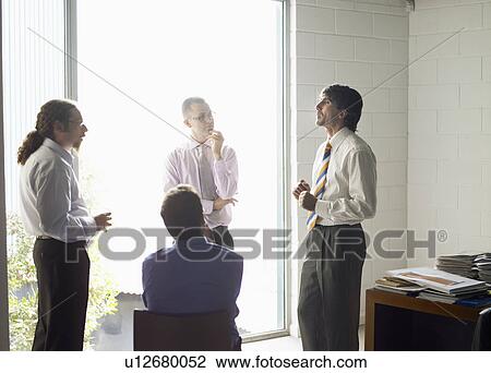 Businesspeople in a meeting View Large Photo Image Stock Image - Businesspeople in a meeting. Fotosearch