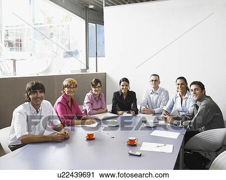 Businesspeople in a meeting View Large Photo Image Stock Image - Businesspeople in a meeting. Fotosearch