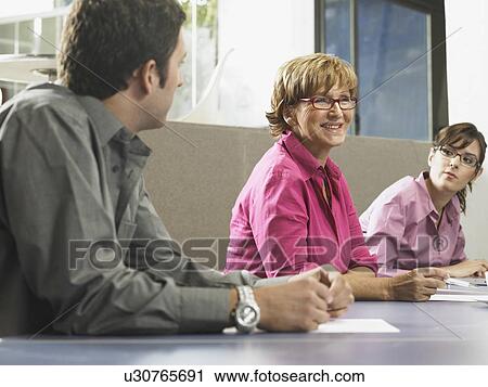 Stock Image - Businesspeople in a meeting. Fotosearch