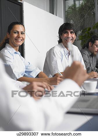 Stock Photo - Businesspeople in a meeting. Fotosearch