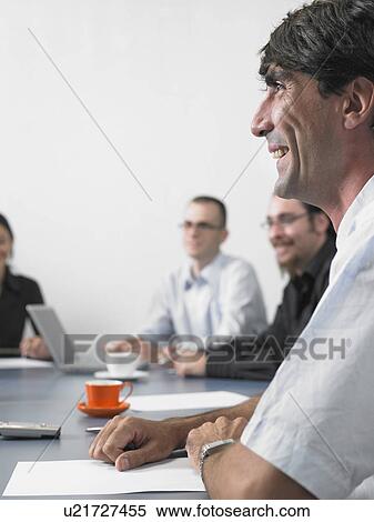Businesspeople in a meeting View Large Photo Image Stock Photography - Businesspeople in a meeting. Fotosearch