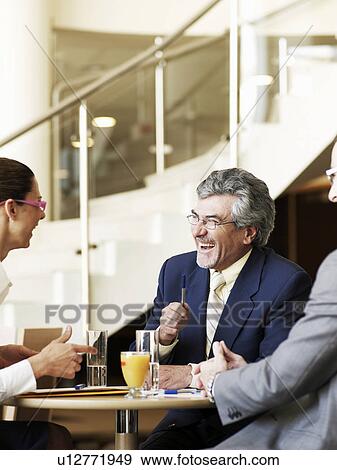 Senior businessman in meeting, smiling View Large Photo Image Stock Photo - Senior businessman in meeting, smiling. Fotosearch