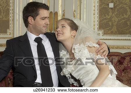 Stock Image - Bride and groom, smiling, portrait. Fotosearch