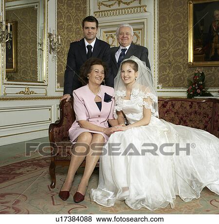 Bride and groom with parents, smiling, portrait View Large Photo Image Stock Photo - Bride and groom with parents, smiling, portrait. Fotosearch
