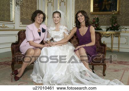 Stock Image - Bride with Mother and Grandmother smiling, portrait. Fotosearch