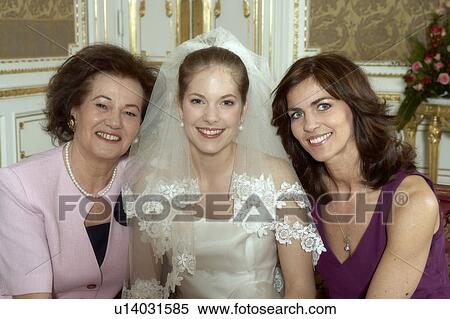 Stock Photography - Bride with Mother and Grandmother smiling, portrait. Fotosearch