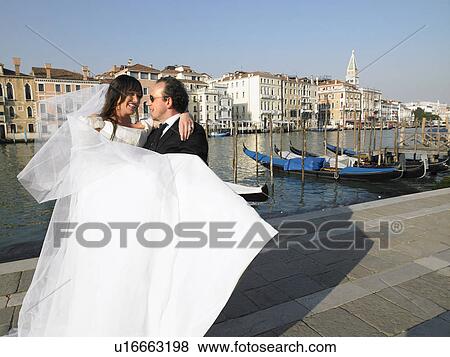 Groom carrying bride. Grand Canal, Venice, Italy. View Large Photo Image Stock Photo - Groom carrying bride. Grand Canal, Venice, Italy.. Fotosearch