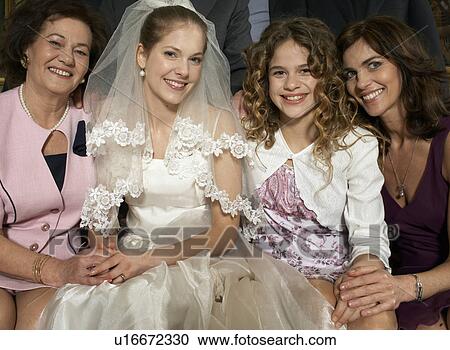 Stock Image - Multigenerational family wedding party smiling, portrait. Fotosearch