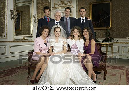 Stock Photography - Multigenerational family wedding party smiling, portrait. Fotosearch